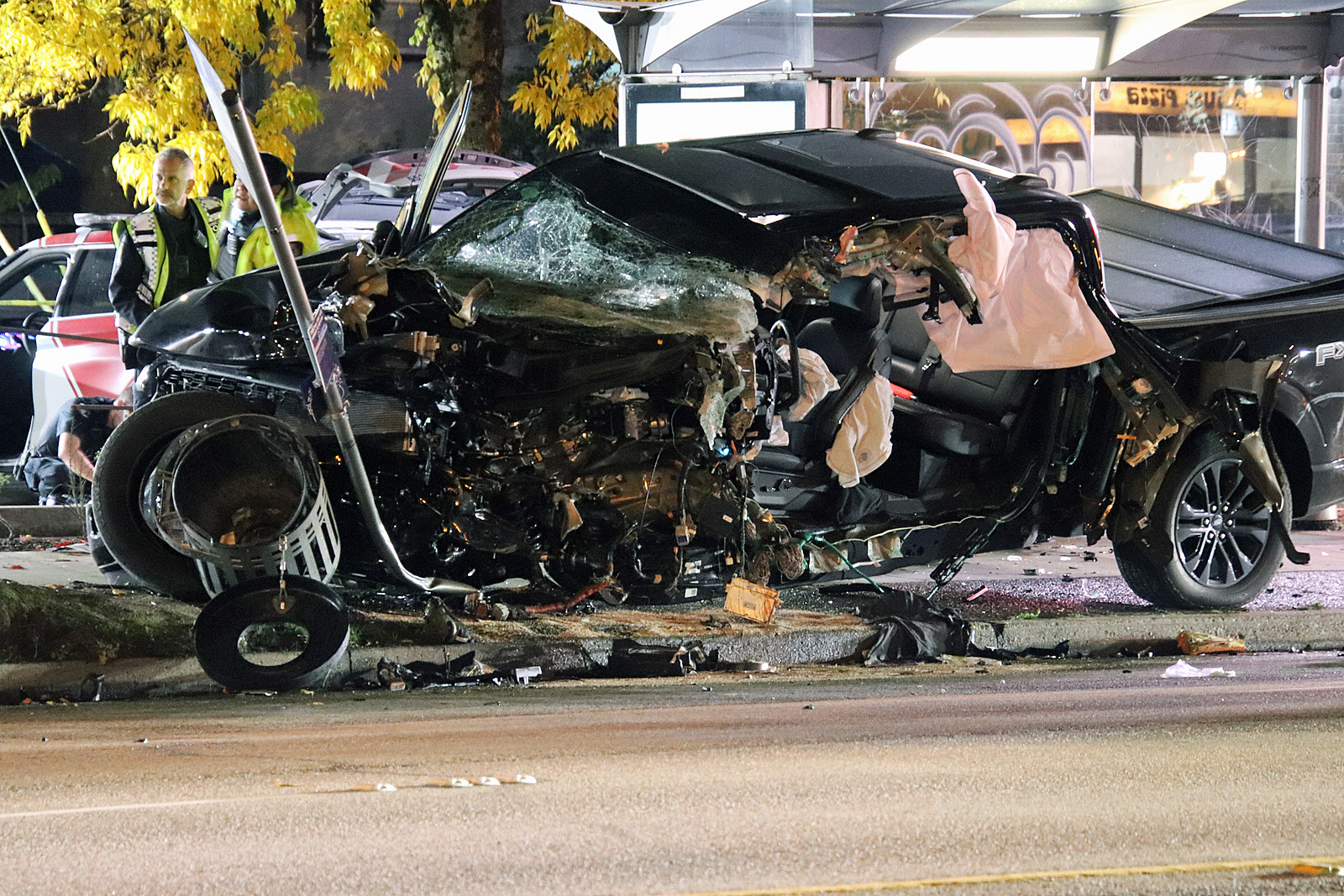 Pickup truck collides with pole near Perry Street and Kingsway, driver pinned and injured