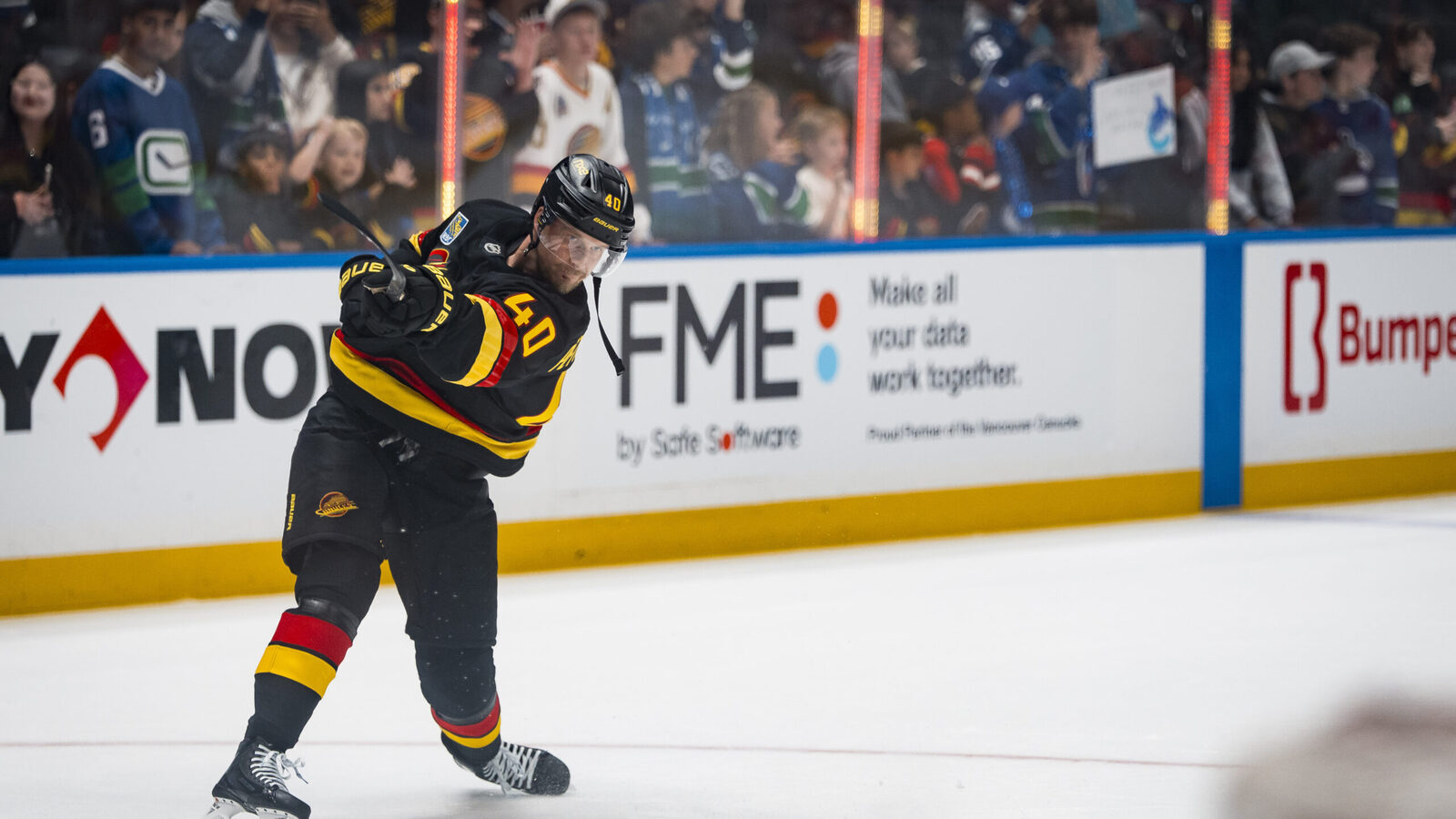 Elias Pettersson helps Canucks rally to beat Flames in a 3rd-period turnaround