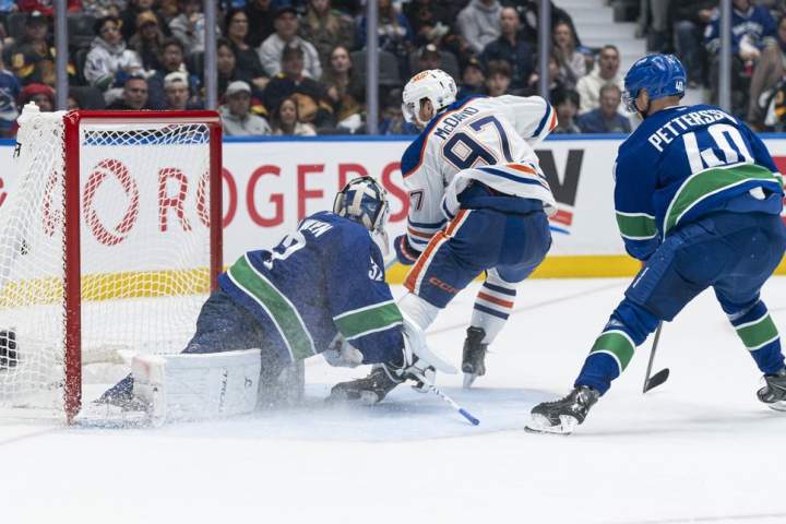 McDavid and Bouchard power Oilers to 9-7 win over Canucks