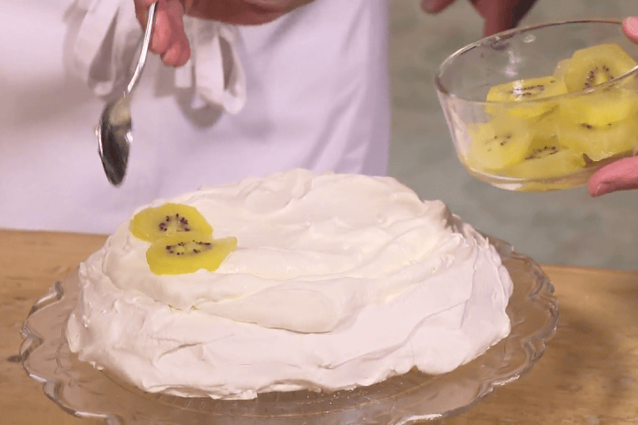 Kiwi pavlova: a simple meringue dessert baked at 200 F and topped with whipping cream