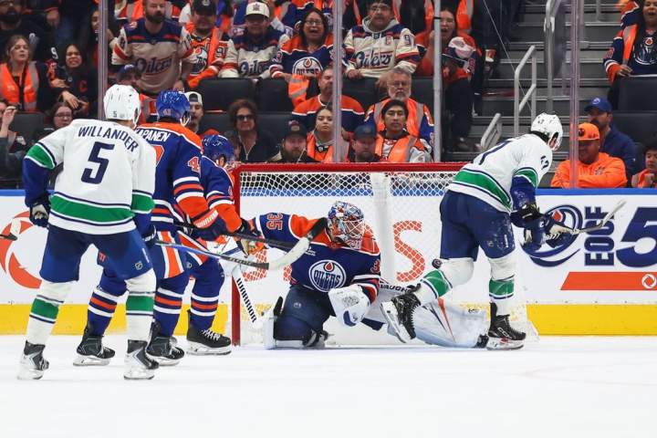 Canucks rally for 6-5 overtime win over Oilers in Manny Malhotra’s season opener