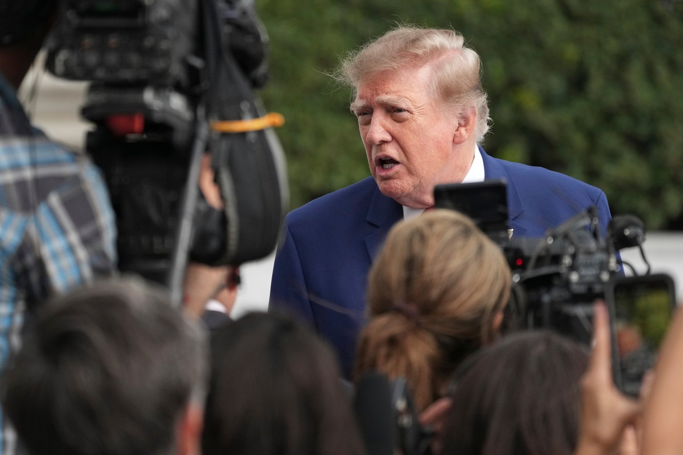 Trump waives Russia sanctions before they take effect, drawing outrage from U.S. lawmakers