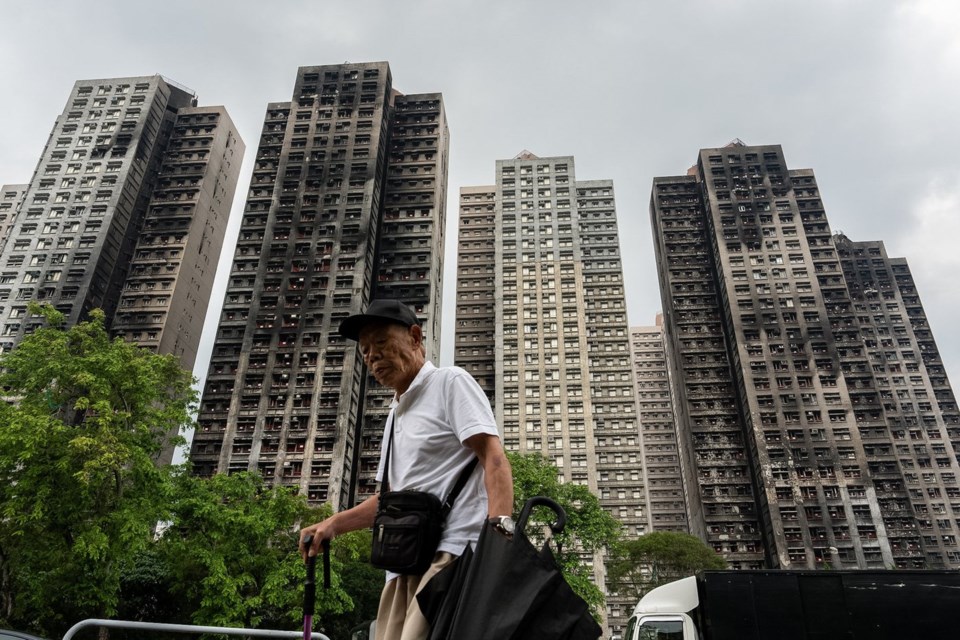 Hong Kong leader apologizes as housing secretary resigns after fire oversight failures found