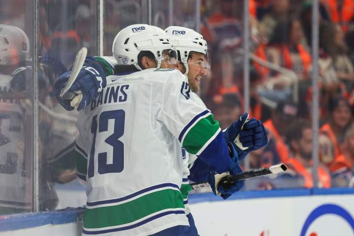 Cotter scores overtime winner as Canucks beat Oilers 6-5
