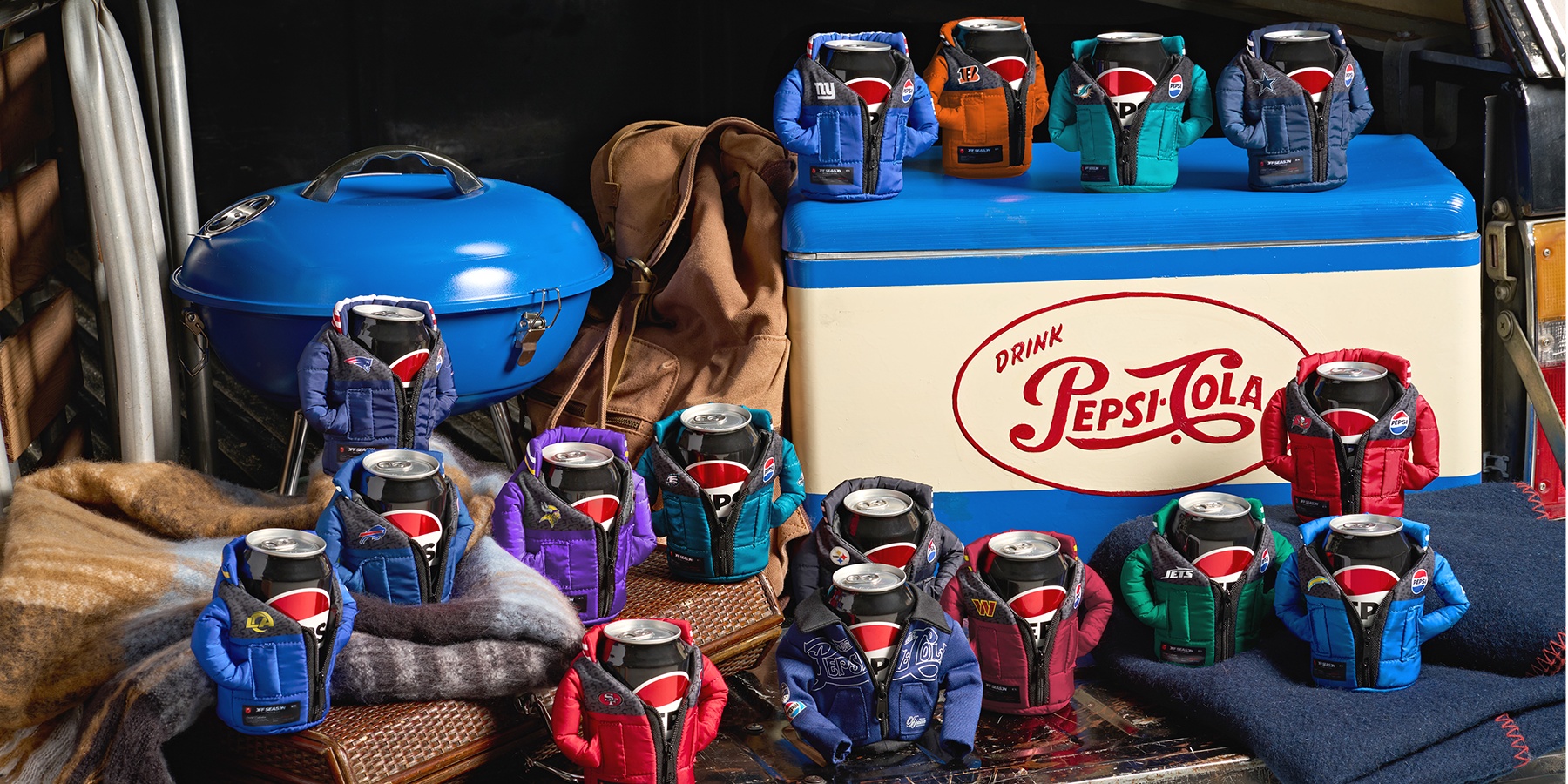 Pepsi and Off Season made tiny NFL puffer jackets for soda cans